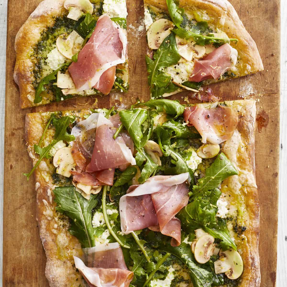 pesto pizza with arugula and prosciutto 1590606842