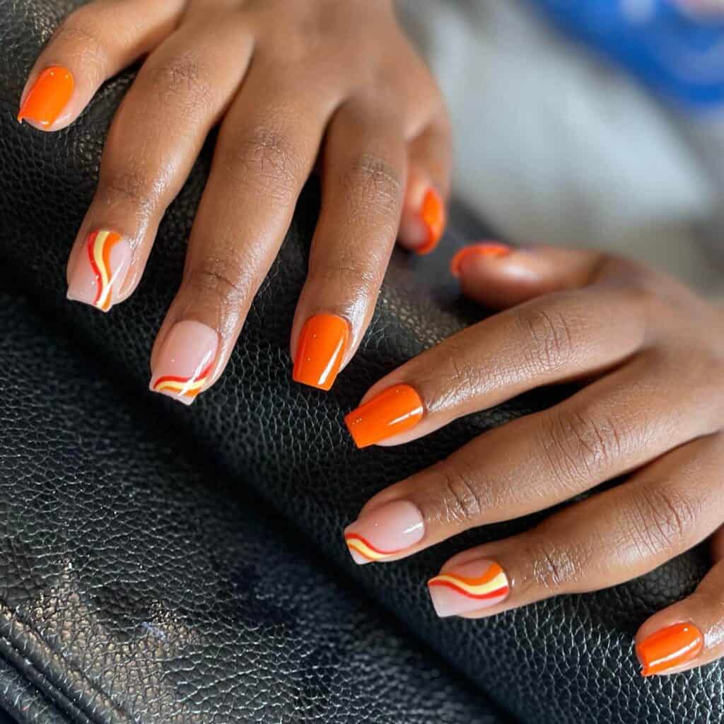 Chic summer nails featuring vibrant orange hues, from neon to burnt with glitter accents, perfect for adding a seasonal touch.