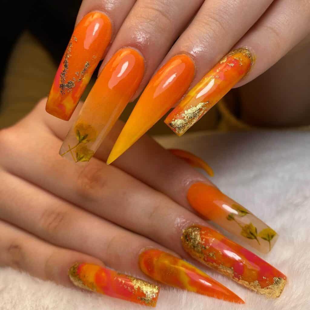 Chic summer nails featuring vibrant orange hues, from neon to burnt with glitter accents, perfect for adding a seasonal touch.