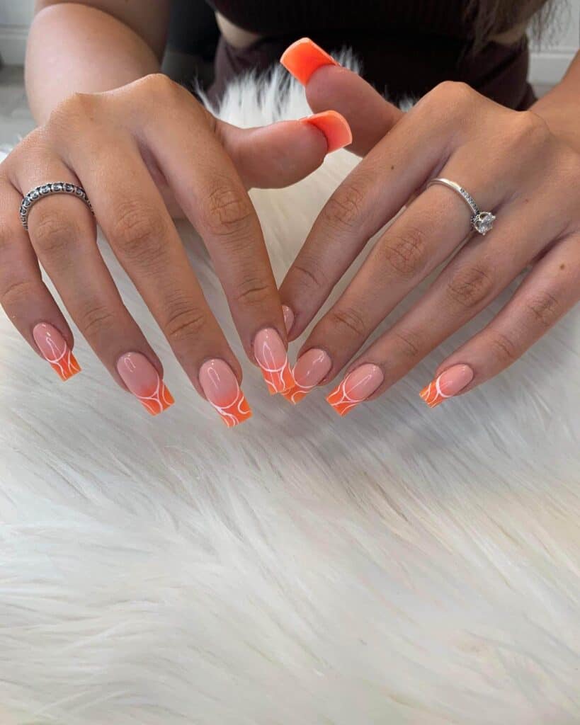 Chic summer nails featuring vibrant orange hues, from neon to burnt with glitter accents, perfect for adding a seasonal touch.